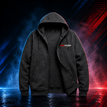 Front view of the Motovational zip-up hoodie in Charcoal Grey with the zip partly open, hood down and chest logo